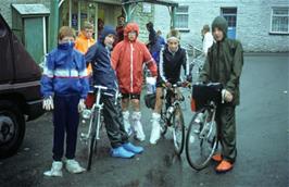 The youngsters outside the grocery store in Llanddewi Brefi, displaying the latest fashion in waterproof overshoes courtesy of the shopkeeper's wife