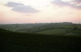 The sun sets behind the hills near Hittisleigh