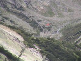 This red helicopter seems to be airlifting boulders in the valley near Stock