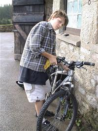 Gage Conway gets his bike ready at Bellever Youth Hostel