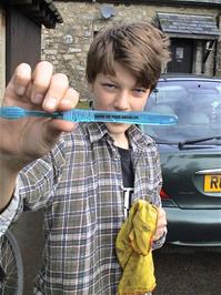 Gage shows us the toothbrush he uses for cleaning his bike - his "cleaning brush" - at Bellever Youth Hostel