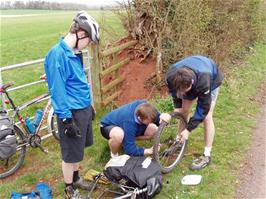Maintenance work on Joe's rear hub after lunch near Terhill, 14.0 miles into the ride from Taunton station