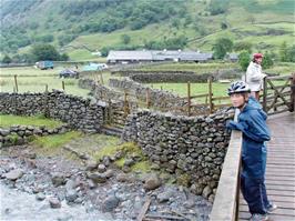 Crossing the footbridge over the River Derwent on our way up to Sourmilk Gill waterfall, 2.3 miles from Borrowdale YH