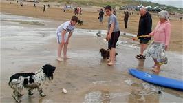 Ash and Zac enjoy talking to a couple and their two delightful dogs on Perranporth Beach 