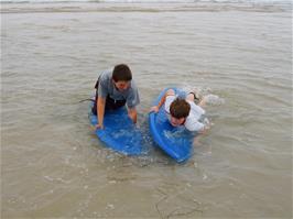 Zac and Ashley get to grips with our rented surf boards at Perranporth