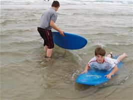 Zac and Ashley get to grips with our rented surf boards at Perranporth