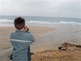 Ash takes video shots of Perranporth Beach from the top of Chapel Rock