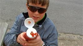 Ash explains how Zac just managed to shoot a fountain of tomato ketchup from this tricky ketchup bottle, outside the shop at Challacombe