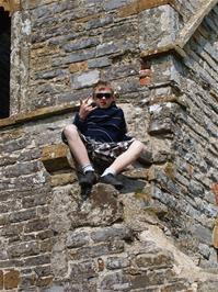 Callum on the ruined church on Burrow Mump