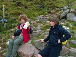 Ryan and Ash take a break during the climb of Ben Nevis just below the lake