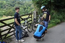 Fixing Callum's puncture on the road to Lustleigh