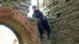 George has received help to climb up to this window in the ruined church on Burrow Mump, but he is not sure how he will get down!