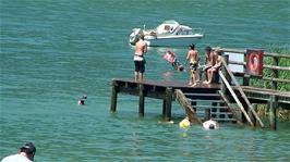 Happy youngsters at Sutz Bathing Beach on Lake Bieler, 20.6 miles into the ride