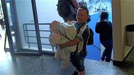 John brings down his laundry at Lucerne Youth Hostel