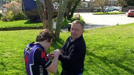 Ash removes prickles from John's hand outside the Heritage and Shipwreck museum, Charlestown