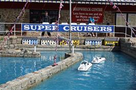 Callum and Lawrence racing boats at the Heritage and Shipwreck museum, Charlestown, 6.8 miles into the ride