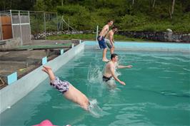 Freeze frame of swimming pool dive