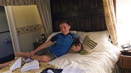 George tests the four-poster bed in one of our luxury rooms at the Ivy Guest House, Hawkshead