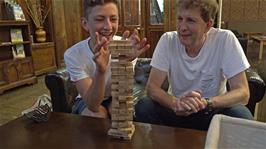George scrapes through another turn at Jenga with Michael in the Great Hall, Langdale YHA 