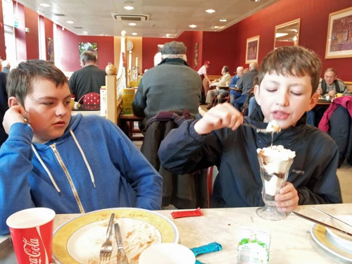 George enjoying ice cream in Morrisons café, Totnes. New photo for 2024.
