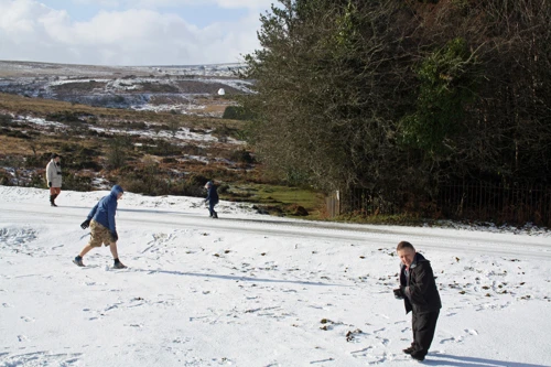 Lawrence takes aim at the lens with a snowball.