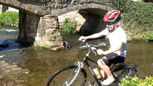 George successfully negotiates the ford at Allerford.