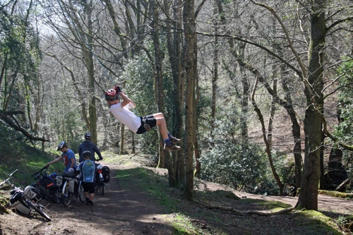 George tests the rope swing in Selworthy Combe.