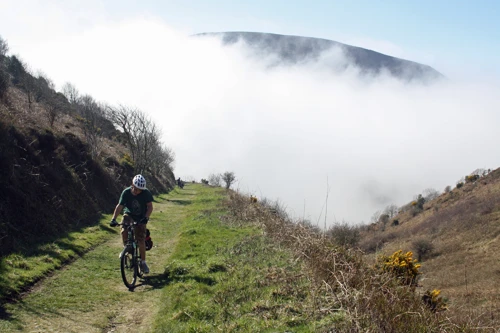 The coast path from the Hunters Inn finally climbs above the fog