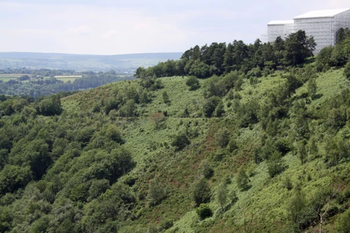 The Hunters' Path descends through fabulous scenery, with Castle Drogo repairs beyond (new photo for 2024)