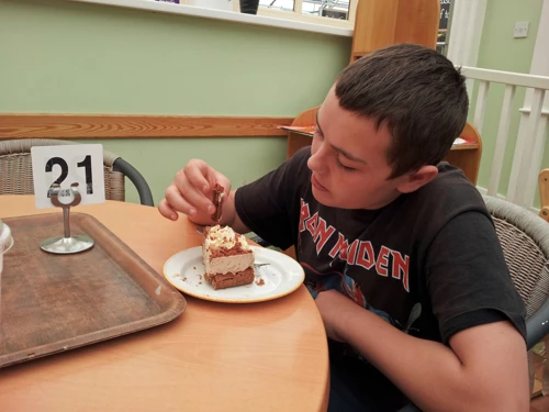 Dillan savours his chocolate flake cheesecake at Fermoy's Garden Centre.