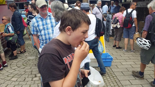 Dillan discovers excellent home-made flapjack at Totnes market.