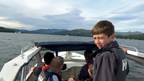 Soaking up the sun in our hire boat on Windermere