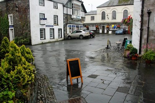 Hawkshead village square on a very wet morning