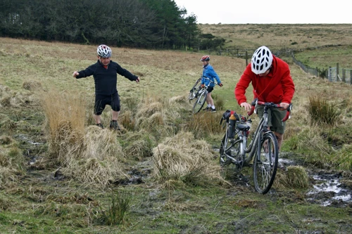 John picks his way through the bog near Water Oak Corner on Abbots Way.