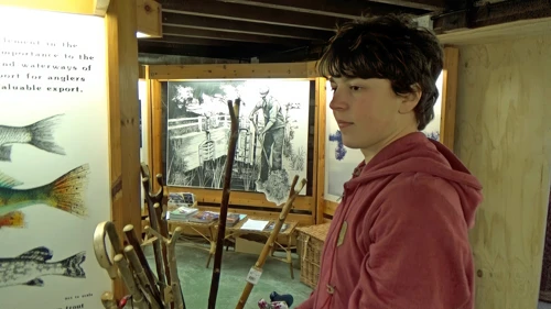 Lawrence inspects willow canes at the Willows & Wetlands Visitor Centre.