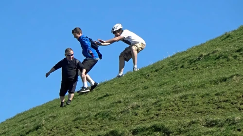 Lawrence helps George down Burrow Mump.