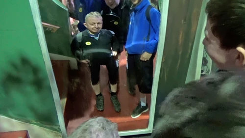 John checks his new look in the Hall of Mirrors at Wookey Hole.