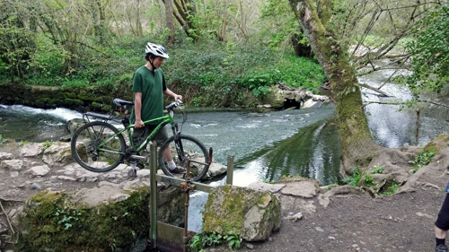 Lawrence crosses the leat.