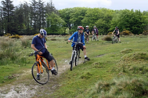 Dillan and George with the group on the moor, Lud Gate behind.