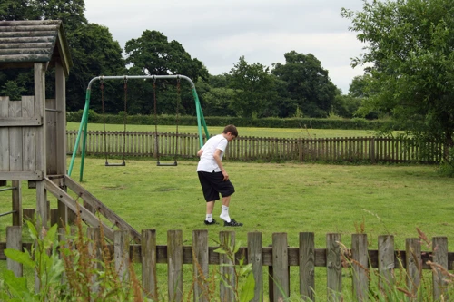 George gets his shoes back on, ready to leave Staverton Play Park.