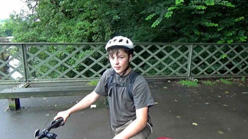 Lawrence on Caton Lune Bridge, recounting his sprint back to Starbucks in Lancaster for a forgotten helmet.