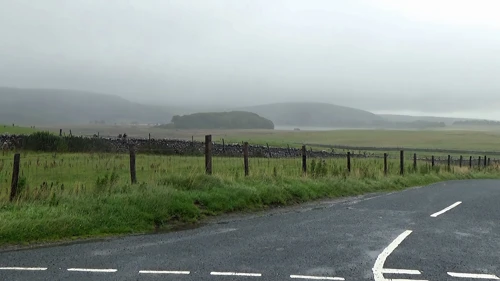 Malham Tarn, just visible through the cloud and rain.