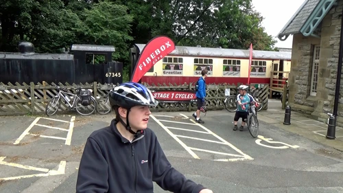 Leaving Stage 1 Cycles and Firebox Café in the old station at Hawes, after Michael’s 10am spoke fix