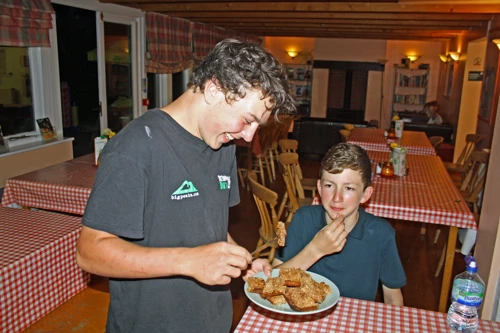 Lawrence samples his home-made flapjack for Michael’s birthday at Helmsley Youth Hostel