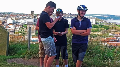 Post-group-shot phone antics: Lawrence, Dillan, George and Will, St Mary’s, Whitby