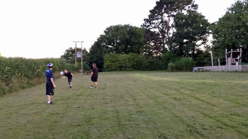 Dillan, George and Gavin playing Frisbee in Holne play park