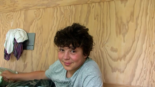 Lawrence delays leaving his comfortable bunk bed for as long as possible after breakfast at Basel Youth Hostel