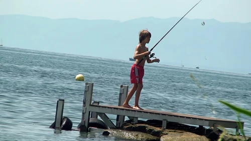 A youngster enjoys his childhood near Ouchy Quay as we eat our lunch