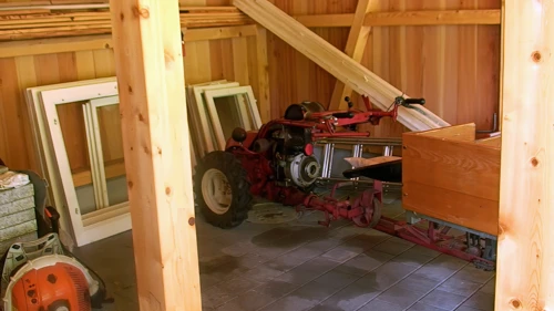 An unusual mini-tractor in a barn at Sengg, 9.9 miles into the ride