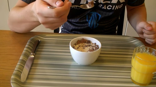 Ash starts his breakfast cereal at Lucerne Youth Hostel, which he describes as a mixture of Krave, chocolate bits and Jordan's Country Crisp - but just an OK rating for taste